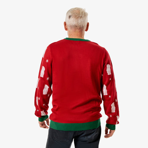 Röd jultröja med Juleskum-motiv och gröna muddar sedd bakifrån på en person från Svenskhusman.