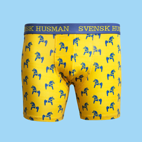 Gula boxerkalsonger med blått dalahästmotiv och logoresår från Svenskhusman