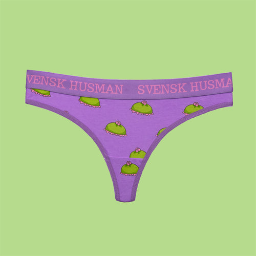 Purple thong underwear with a green princess cake pattern by Svenskhusman.